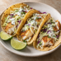 AI illustration of pan-seared white fish tacos with shredded cabbage and lime yogurt sauce.